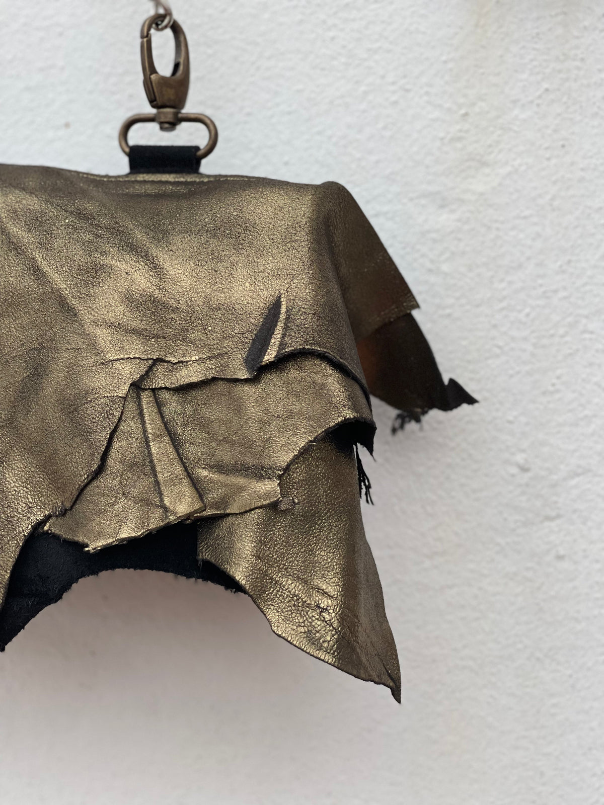 Golden Hour bronze leather bag worn in Ibiza