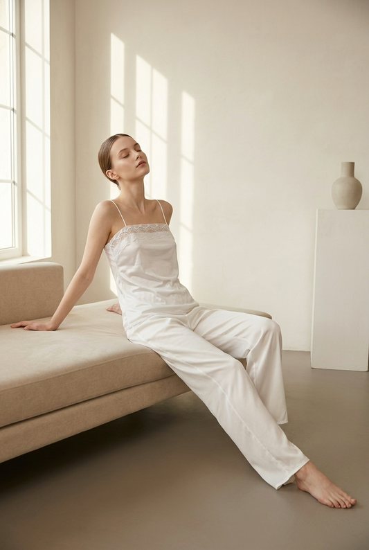 Hush white embroidered camisole worn with flowing white trousers